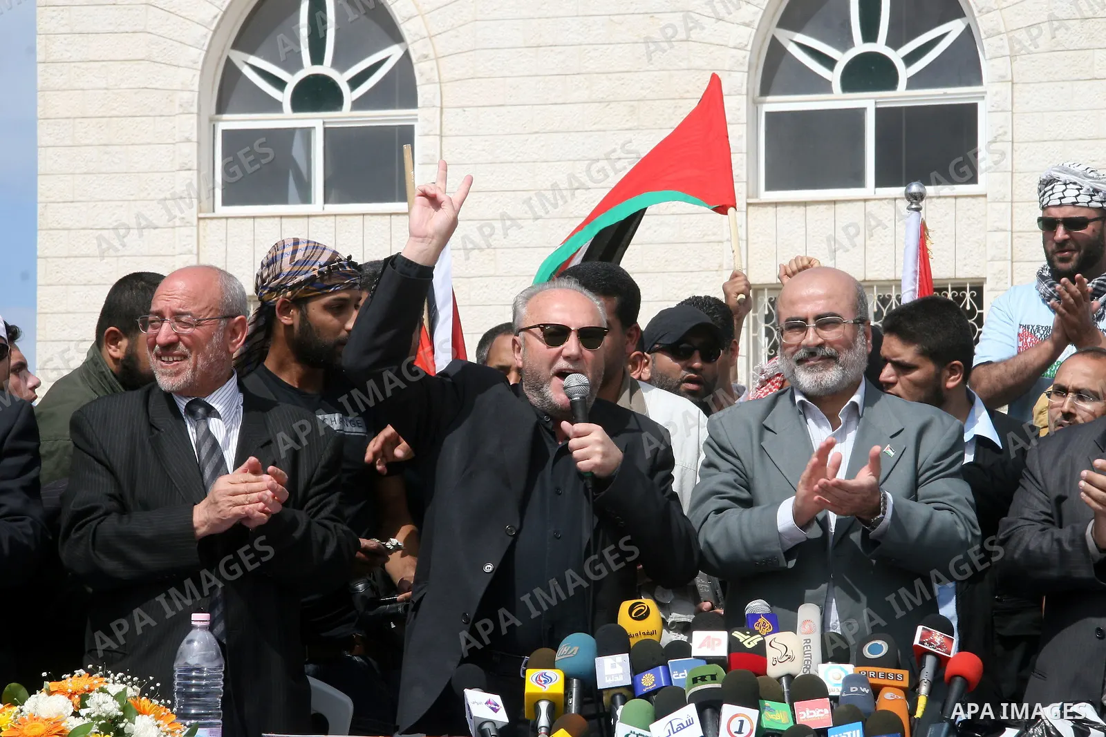 British MP George Galloway flashes the 'V' for victory sign near Hamas deputy prime minister Ziad al-Zaza during a ceremony in Gaza City on March 10, 2009. Firebrand British MP George Galloway donated thousands of Britis...