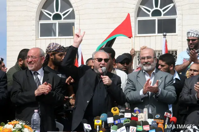 British MP George Galloway flashes the 'V' for victory sign near Hamas deputy prime minister Ziad al-Zaza during a ceremony in Gaza City on March 10, 2009. Firebrand British MP George Galloway donated thousands of Britis...
