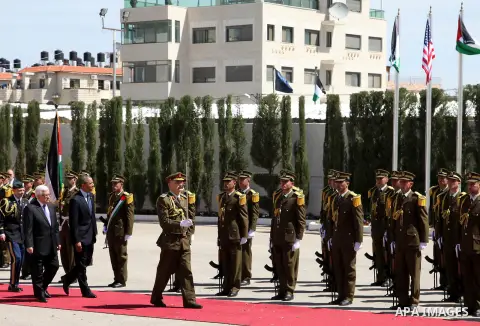 US President Barack Obama and Palestinian president Mahmud Abbas review the honour guard during an official arrival ceremony at the Muqata, the Palestinian Authority headquarters in the West Bank city of Ramallah, on Mar...