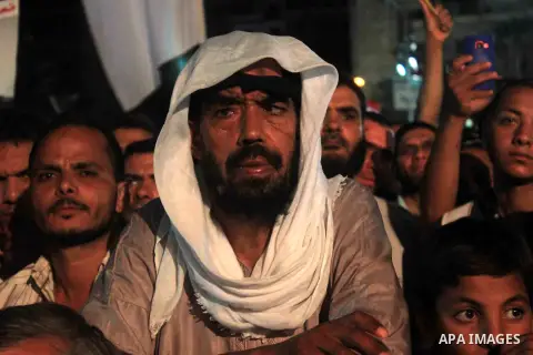 Supporters of Egypt's ousted President Mohammed Morsi chant slogans during a protest outside Rabaa al-Adawiya mosque, where they have installed a camp and hold daily rallies at Nasr City, in Cairo, Egypt, Wednesday, July...