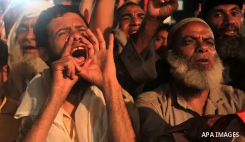 Supporters of Egypt's ousted President Mohammed Morsi chant slogans during a protest outside Rabaa al-Adawiya mosque, where they have installed a camp and hold daily rallies at Nasr City, in Cairo, Egypt, Wednesday, July...