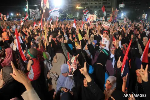 Supporters of Egypt's ousted President Mohammed Morsi chant slogans during a protest outside Rabaa al-Adawiya mosque, where they have installed a camp and hold daily rallies at Nasr City, in Cairo, Egypt, Wednesday, July...