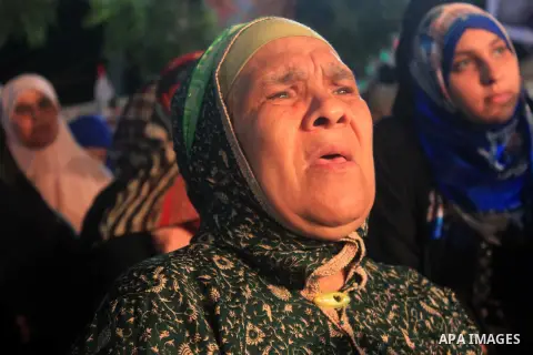Supporters of Egypt's ousted President Mohammed Morsi chant slogans during a protest outside Rabaa al-Adawiya mosque, where they have installed a camp and hold daily rallies at Nasr City, in Cairo, Egypt, Wednesday, July...