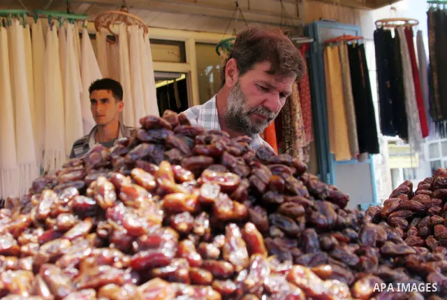 Palestinians shop at a traditional market in preparation for the holy month of Ramadan. Islam's holy month of Ramadan will begin in 13 September in the Middle East depending on the sighting of the crescent moon. Muslims...