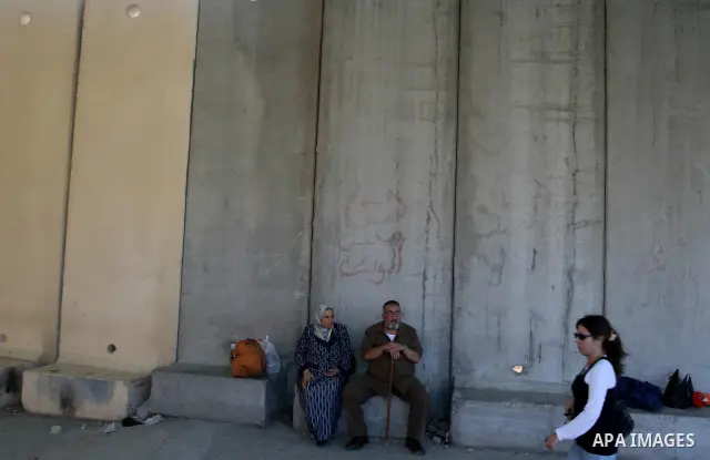 Palestinians leave Gaza through the Erez crossing in the northern Gaza strip. Hundreds of Palestinians left through the northern Erez crossing on their way to Egypt after Israeli authorities granted permission to those h...