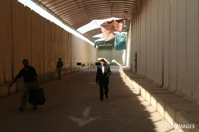 Palestinians leave Gaza through the Erez crossing in the northern Gaza strip. Hundreds of Palestinians left through the northern Erez crossing on their way to Egypt after Israeli authorities granted permission to those h...