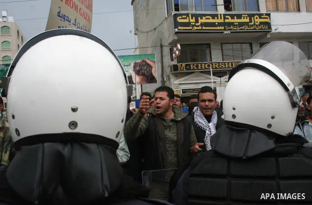 Palestinians attend a protest to demand jobs in the Palestinian Authority, in Gaza. Palestinian leaders struck discordant notes on how to deal with Israel on Saturday as parliament met to usher in a unity government inte...