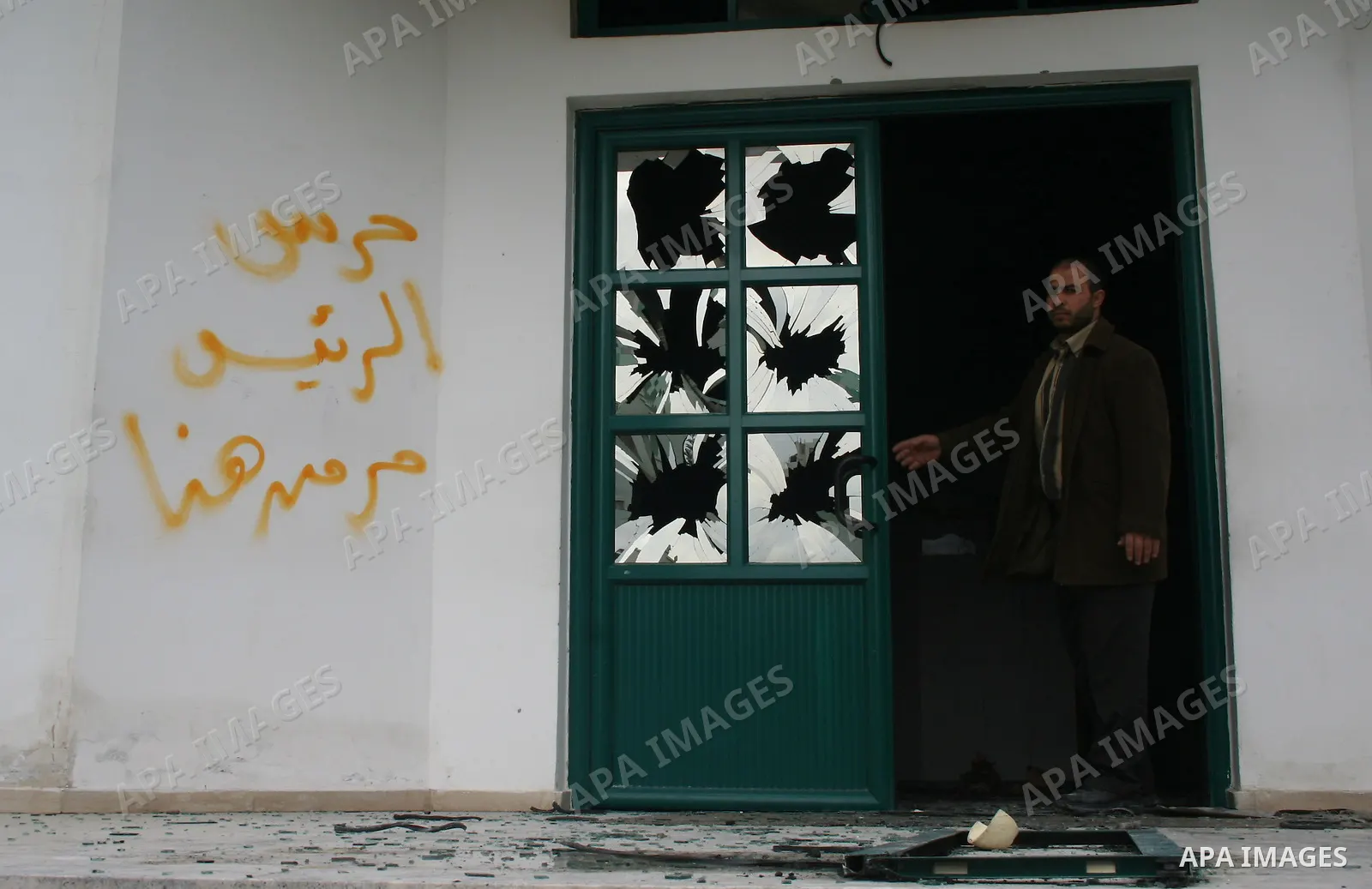 Palestinians inspect a burnt building inside the Islamic University after it was attacked in Gaza. Fighting between rival Palestinian factions escalated across Gaza on Friday, killing at least 17 people, as Hamas Islamis...
