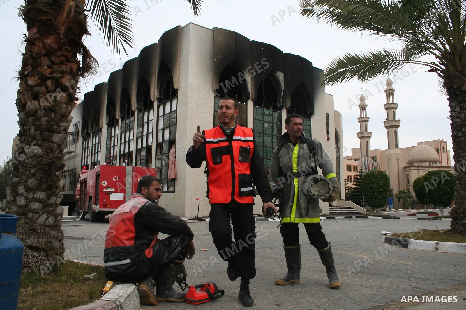 Palestinians inspect a burnt building inside the Islamic University after it was attacked in Gaza. Fighting between rival Palestinian factions escalated across Gaza on Friday, killing at least 17 people, as Hamas Islamis...