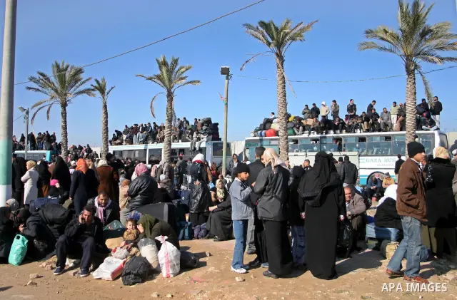 Palestinians wait in and outside buses to enter the Rafah border crossing terminal between the Gaza Strip and Egypt. The Rafah border crossing opened on Tuesday allowing people to travel in and out of the Gaza Strip. Isr...
