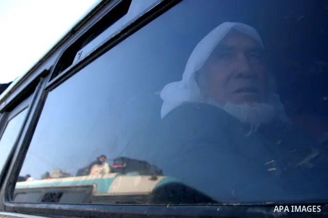 Palestinians wait in and outside buses to enter the Rafah border crossing terminal between the Gaza Strip and Egypt. The Rafah border crossing opened on Tuesday allowing people to travel in and out of the Gaza Strip. Isr...