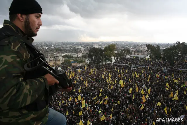 Palestinian Fatah militants, loyal to their leader Mahmud Abbas, participate in a rally in Gaza City to celebrate 42 years since the party's founding. Abbas dug in his heels in a standoff with the ruling Hamas movement t...