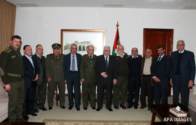 Palestinian President Mahmoud Abbas, (Abu Mazen) meets with staff of the national policy guidance, in the West Bank City of Ramallah, on Mar. 18, 2012. Photo by Thaer Ganaim