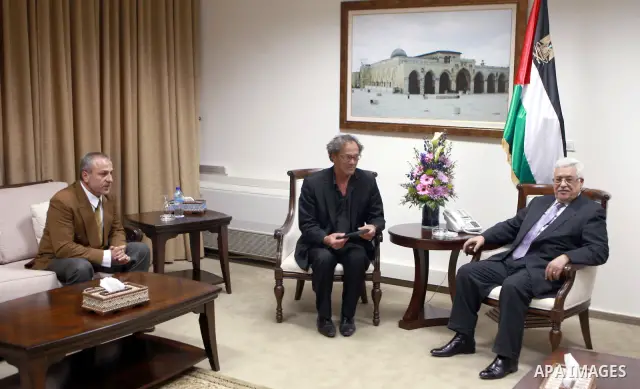 Palestinian President, Mahmoud Abbas (Abu Mazen), meets with film director Mohammed Bakri and artist Said Al Nahri in the West Bank city of Ramallah on Mar. 25, 2012. Photo by Thaer Ganaim