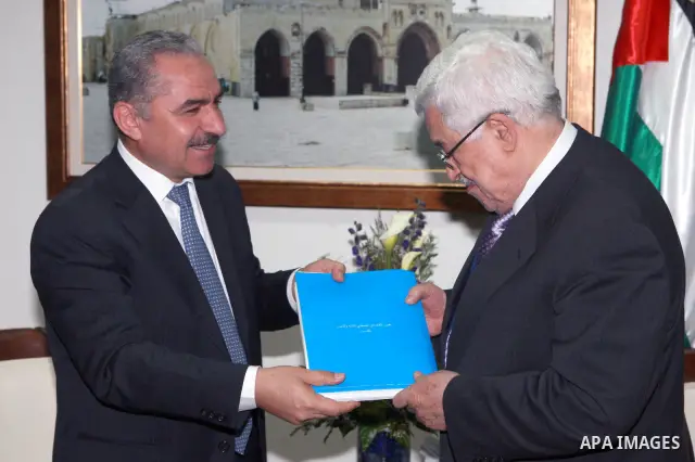 Palestinian President, Mahmoud Abbas (Abu Mazen) receives the annual report of the Palestinian Economic Council for Development and Reconstruction in the West Bank city of Ramallah on Mar. 25, 2012. Photo by Thaer Ganaim
