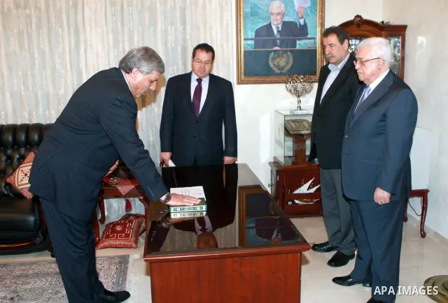 Palestinian president Mahmud Abbas, meets with ambassador of the State of Palestine in Libya, Mutawakkil Taha, during swear the constitutional oath in the Jordan Capital of Amman, on Mar. 28, 2012. Photo by Thaer Ganaim