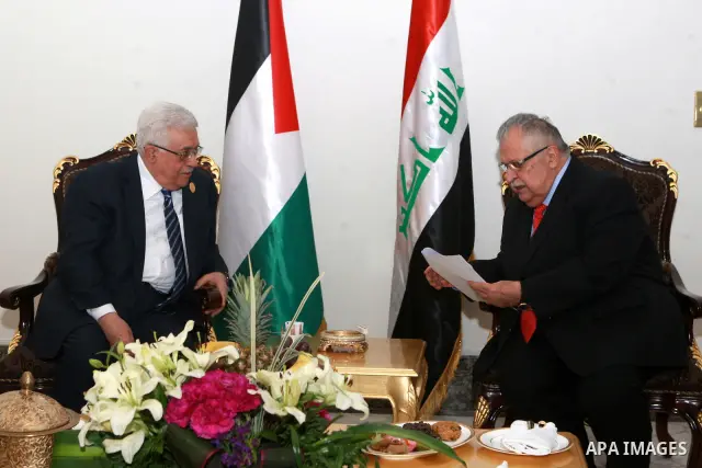 Palestinian President Mahmoud Abbas meets with Iraqi President Jalal Talabani in Baghdad, Iraq, Thursday, March, 29, 2012. The annual Arab summit meeting opened in the Iraqi capital Baghdad on Thursday with only 10 of th...