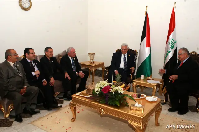 Palestinian President Mahmoud Abbas meets with Iraqi President Jalal Talabani in Baghdad, Iraq, Thursday, March, 29, 2012. The annual Arab summit meeting opened in the Iraqi capital Baghdad on Thursday with only 10 of th...