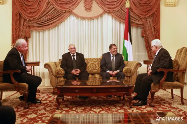 Palestinian President, Mahmoud Abbas (Abu Mazen), meets with the leader of freedom and justice in Egypt Mohamed Morsi, in the Egypt capital Cairo, on Apr. 02, 2012. Photo by Thaer Ganaim