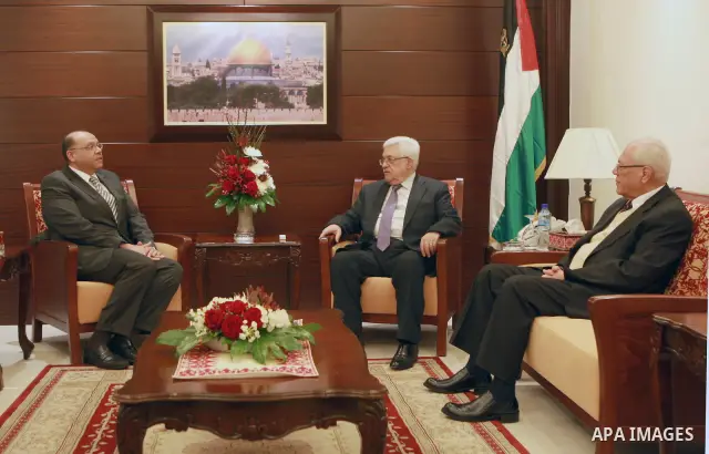 Palestinian President, Mahmoud Abbas (Abu Mazen) meets with Egyptian ambassador to the National Authority, Yasser Osman, in the West Bank city of Ramallah, on Apr. 07, 2012. Photo by Thaer Ganaim