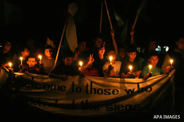 Palestinians hold candles as they march during a demonstration against the Israeli fuel cut, in Gaza City. Defense Minister Ehud Barak decided not to resume much-needed fuel shipments to the Gaza Strip on Monday because...