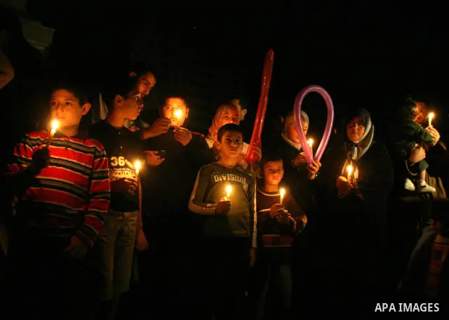 Palestinians hold candles as they march during a demonstration against the Israeli fuel cut, in Gaza City. Defense Minister Ehud Barak decided not to resume much-needed fuel shipments to the Gaza Strip on Monday because...
