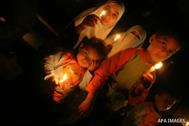 Palestinians hold candles as they march during a demonstration against the Israeli fuel cut, in Gaza City. Defense Minister Ehud Barak decided not to resume much-needed fuel shipments to the Gaza Strip on Monday because...