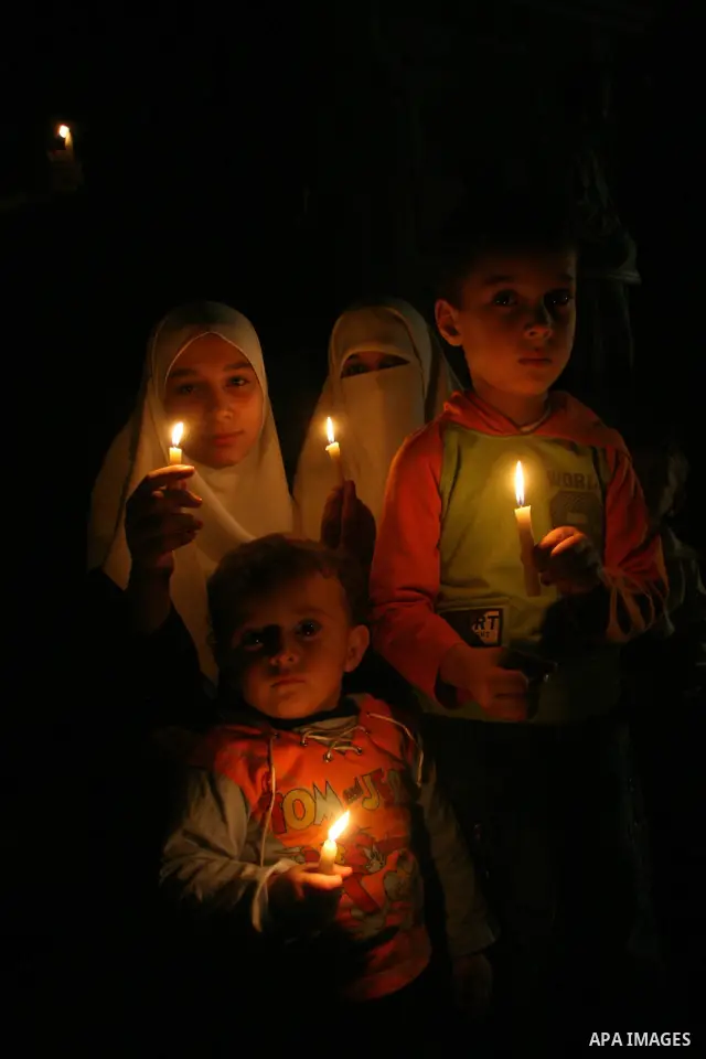Palestinians hold candles as they march during a demonstration against the Israeli fuel cut, in Gaza City. Defense Minister Ehud Barak decided not to resume much-needed fuel shipments to the Gaza Strip on Monday because...