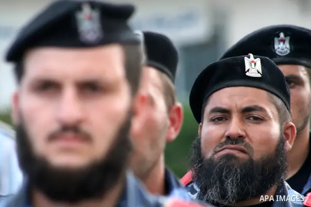Palestinian police loyal to the Hamas movement take part in a graduation ceremony in Gaza City. The Hamas rulers of the Gaza Strip released 17 member of the rival Fatah movement today in what it called a goodwill gesture...
