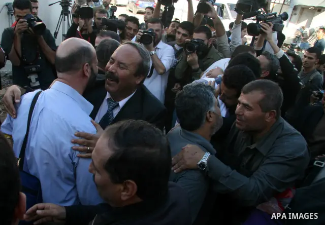 Fatah members in the Gaza Strip are received by their relatives as they walk out from the al-Saraya prison following their release, in Gaza City. The Hamas rulers of the Gaza Strip released 17 member of the rival Fatah m...