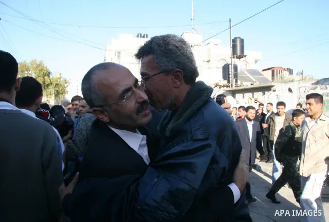 Fatah members in the Gaza Strip are received by their relatives as they walk out from the al-Saraya prison following their release, in Gaza City. The Hamas rulers of the Gaza Strip released 17 member of the rival Fatah m...