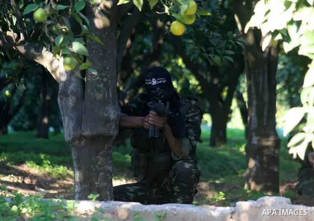 Palestinian militants of the Nasser Salah al-Din Brigades, the military wing of the Popular Resistance Committees, take part in a training exercise in Gaza City . Israel and Hamas ratcheted up the rhetoric today ahead of...