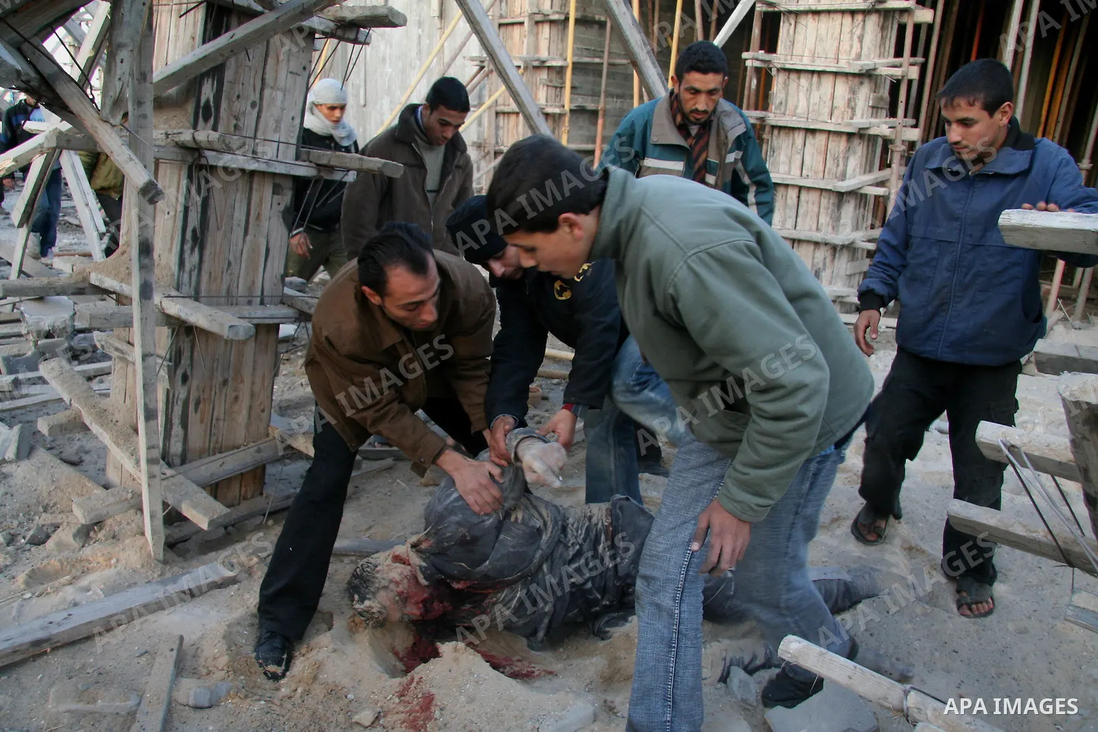 Palestinians look at destroyed buildings after an explosion from an Israeli missile strike in Gaza City. Israeli warplanes pounded the Hamas-ruled Gaza Strip for a third consecutive day on Monday and the Jewish state pre...