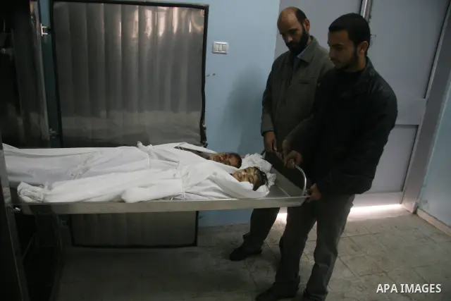 The bodies of two girls, aged four and 11, who were killed in an Israeli air strike in Beit Hanun in the northern Gaza Strip. Israel is bombing Gaza for a fourth day, warning the blitz that has killed at least 360 people...
