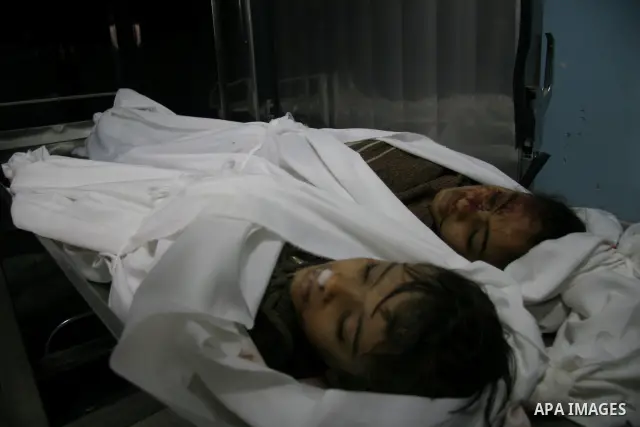 The bodies of two girls, aged four and 11, who were killed in an Israeli air strike in Beit Hanun in the northern Gaza Strip. Israel is bombing Gaza for a fourth day, warning the blitz that has killed at least 360 people...