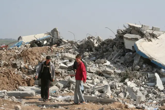A Palestinian man inspects his destroyed house after an Israeli operation in the northern Gaza Strip, 07 February 2009Israel launched air strikes in Gaza late February 6 to strike tunnels which Israel says are used to sm...
