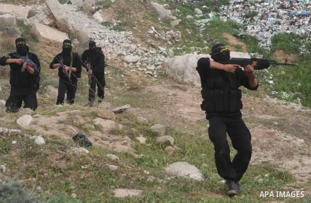 Palestinian Islamic Jihad militants train during a military exercise in Gaza City on February 10, 2009. Israel voted in a tight race between hawkish former premier Benjamin Netanyahu and centrist Foreign Minister Tzipi L...
