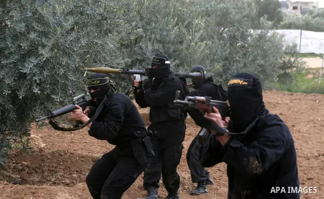 Palestinian Islamic Jihad militants train during a military exercise in Gaza City on February 10, 2009. Israel voted in a tight race between hawkish former premier Benjamin Netanyahu and centrist Foreign Minister Tzipi L...