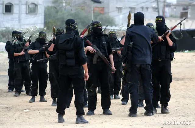 Palestinian Islamic Jihad militants train during a military exercise in Gaza City on February 10, 2009. Israel voted in a tight race between hawkish former premier Benjamin Netanyahu and centrist Foreign Minister Tzipi L...