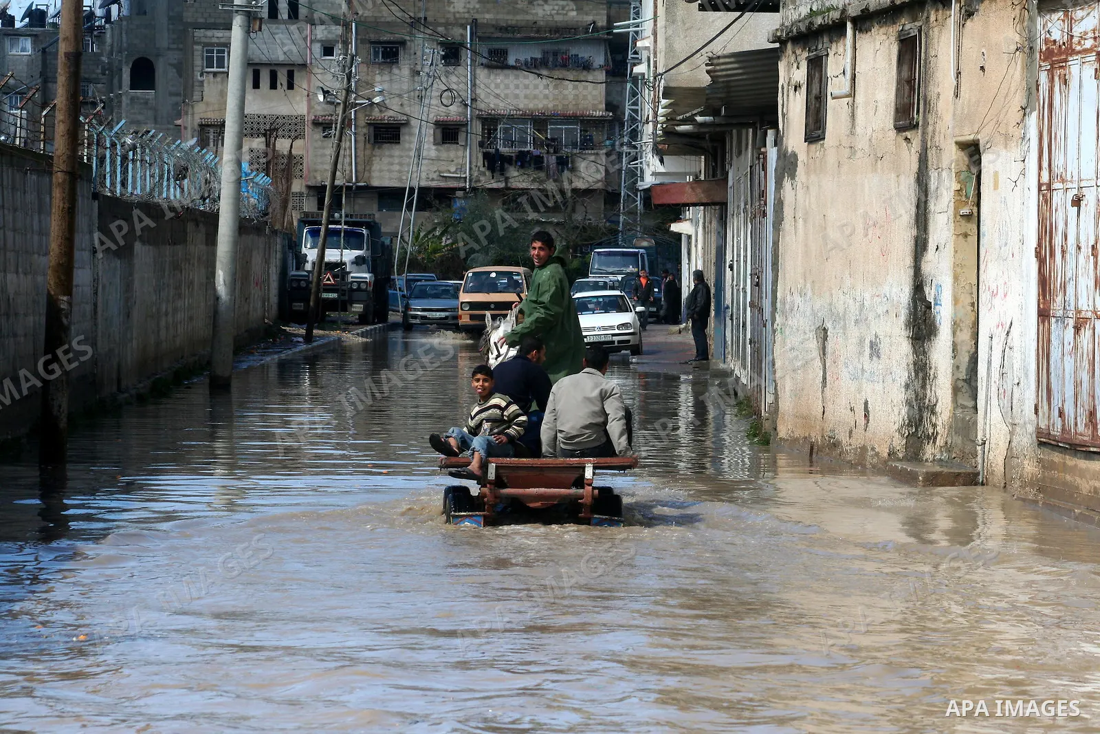 Palestinians ride on a horse cart after heavy rain in Gaza March 1, 2009. The World Bank said on Sunday it would urge international financial support for rebuilding the Gaza Strip through direct donation to both the West...