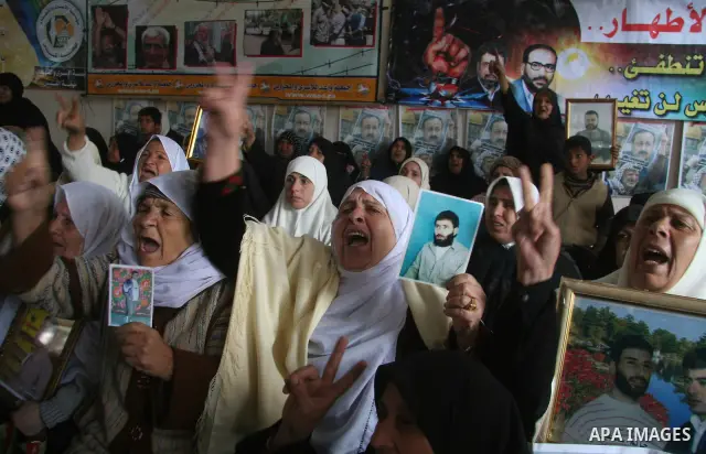 Palestinians take part in a protest in Gaza City calling for the release of Palestinian prisoners held in Israeli jails March 2, 2009 APAIMAGES PHOTO / Ashraf Amra