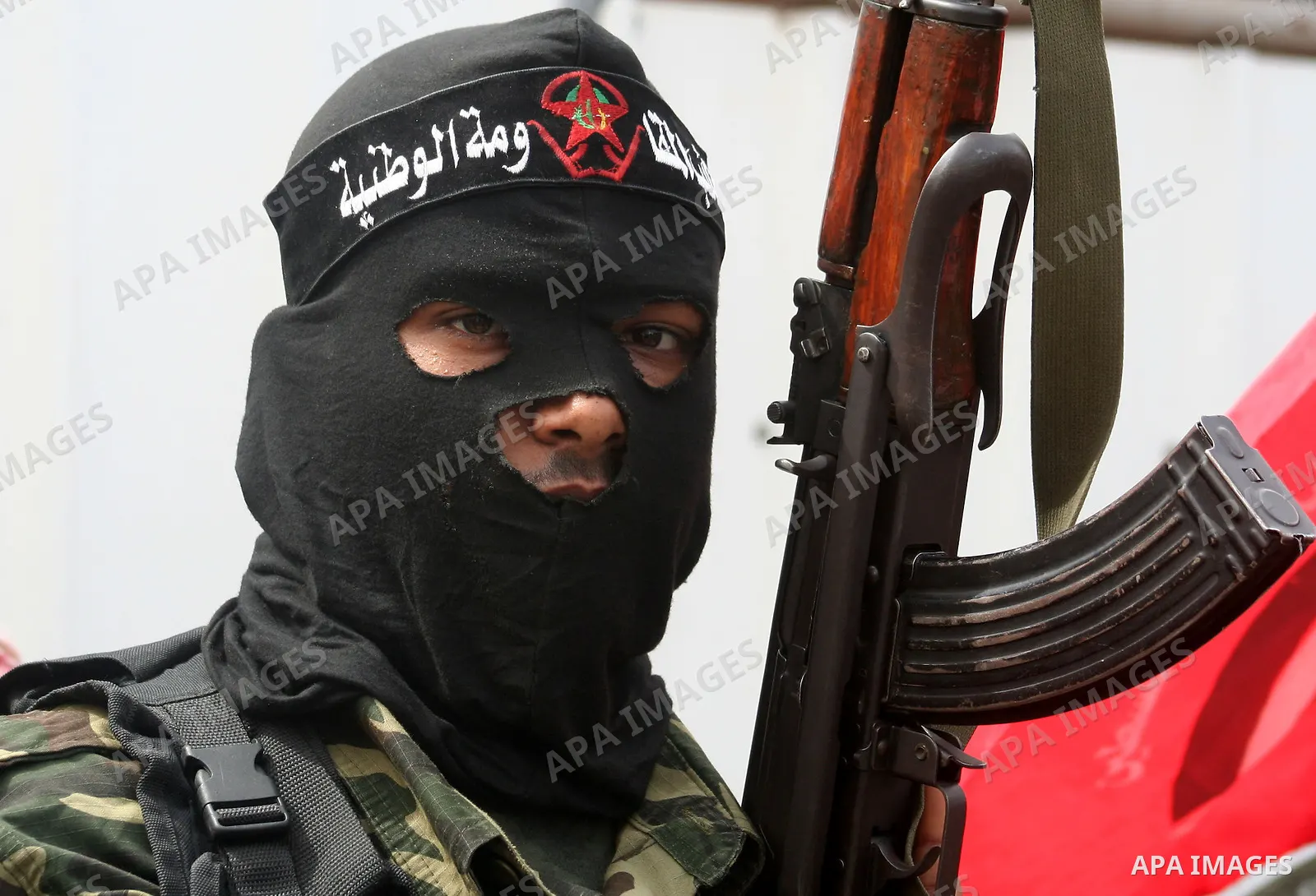 Palestinian militants from the Popular Front wait for the beginning of a funeral for two Palestinian militants in Deir Al-Balah, central Gaza Strip, Thursday, March 5, 2009. Israeli air strike early Thursday killed two I...