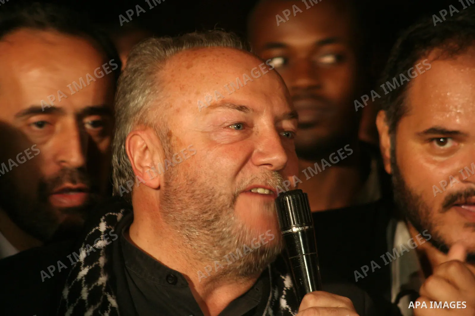 British lawmaker George Galloway, second from left, walks with a Hamas official after having crossed with his entourage from Egypt through the Rafah border crossing to Gaza, in Gaza City, Monday, March 9, 2009. On Monday...