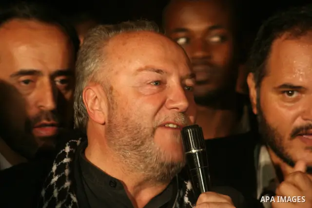 British lawmaker George Galloway, second from left, walks with a Hamas official after having crossed with his entourage from Egypt through the Rafah border crossing to Gaza, in Gaza City, Monday, March 9, 2009. On Monday...