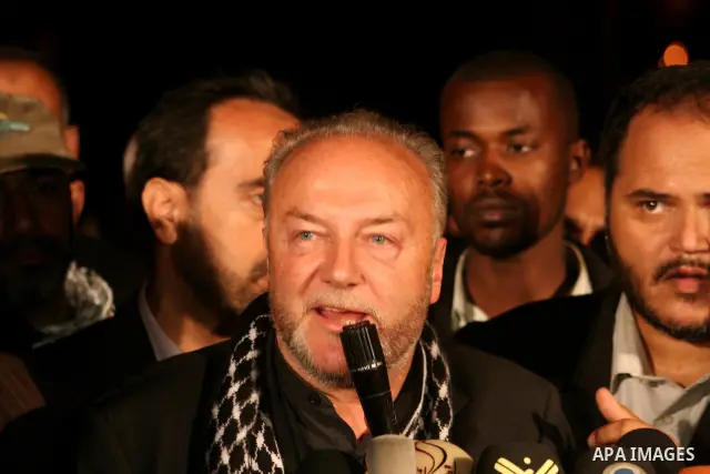 British lawmaker George Galloway, second from left, walks with a Hamas official after having crossed with his entourage from Egypt through the Rafah border crossing to Gaza, in Gaza City, Monday, March 9, 2009. On Monday...