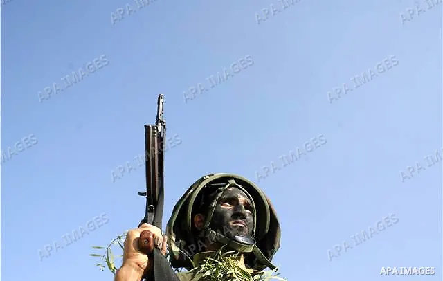 New members of the Islamic Jihad fighters blow up a building as they attend a military show in the former Israeli jewish settlement of Atsmona in Rafah, southern of Gaza Strip. Saraya Al-Quds the military wing of the Pal...
