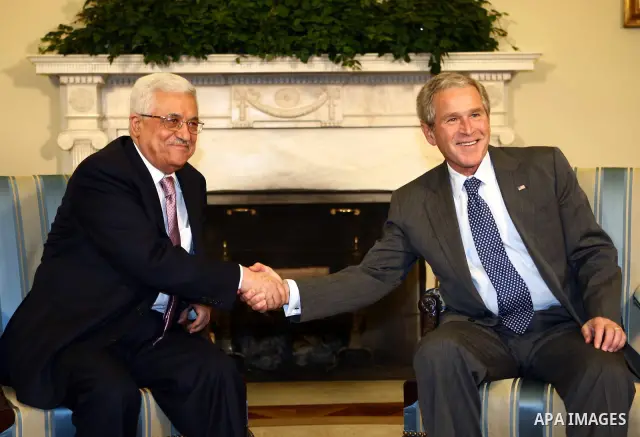 Palestinian President Mahmoud Abbas meets with U.S. President George W. Bush at the White House in Washington.