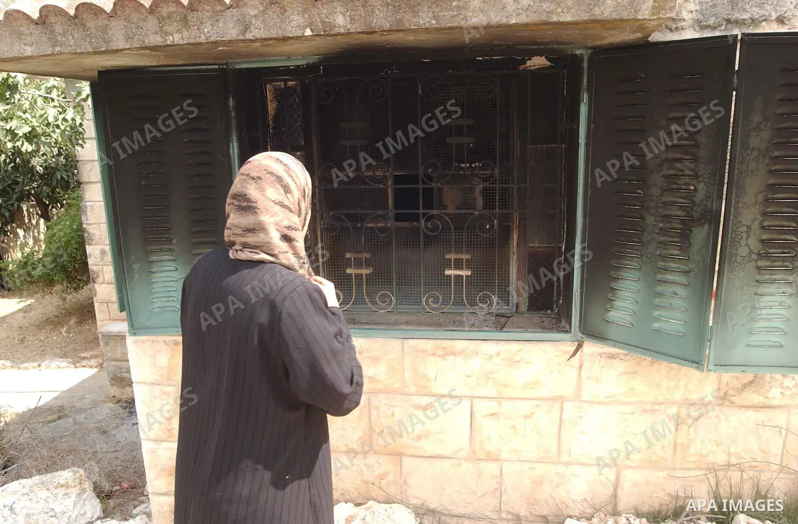 Palestinians inspect a burnt house after Israeli settlers burn house Mahmood An najar in Boreen village in the West Bank city of Nablus.