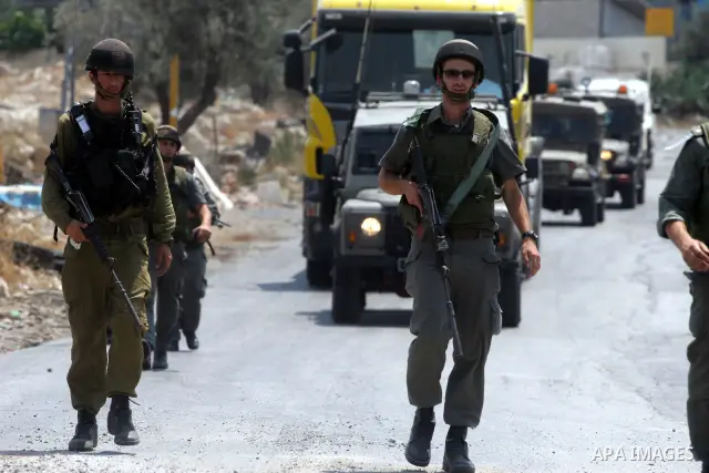 Israeli soldiers fire teargas and rubber bullets at Palestinian protestors during a demonstration against the construction of the controversial Israeli cement barrier in the West Bank village of Nilin near Ramallah.