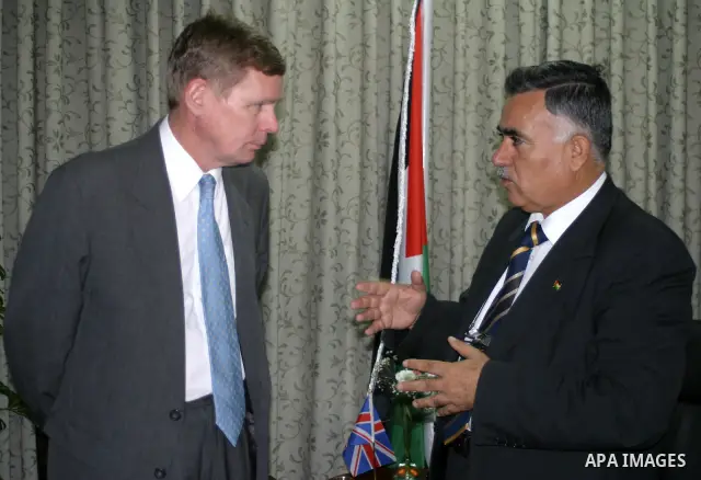 Palestinian Governor of Hebron Hussein al-Araj (R) receives the British Consul in Jerusalem Retchard Makepeas, during his visit to the West Bank city of Hebron.